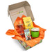 An example of a corrugated gift box with example products, box branded and orange tissue gift-box filler.
