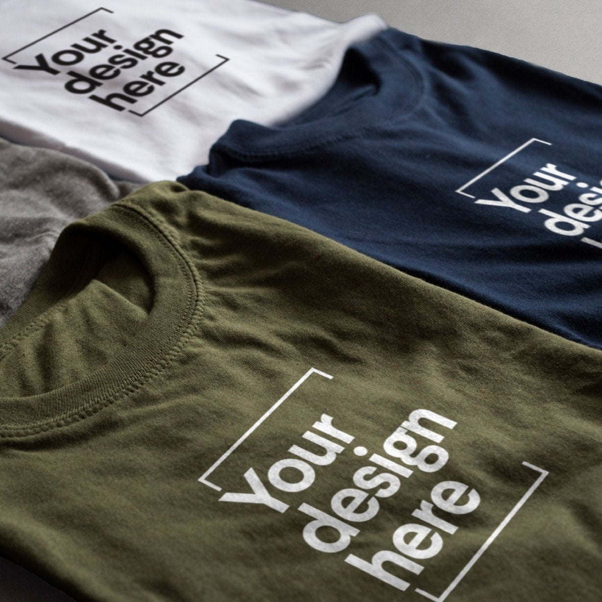 A set of t shirts in different colours showing customisable sections on each t shirt