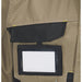 Shows detail on a multi-pocketed beige work vest, sleeveless jacket or gilet.