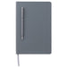 Grey notebook with a grey ballpoint pen