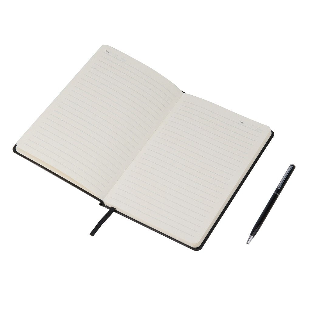 Open notebook with a ballpoint pen beside it