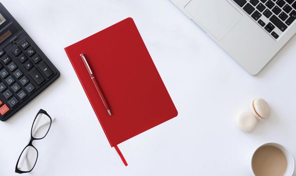 Red notebook with a red ballpoint pen and other corporate gift examples