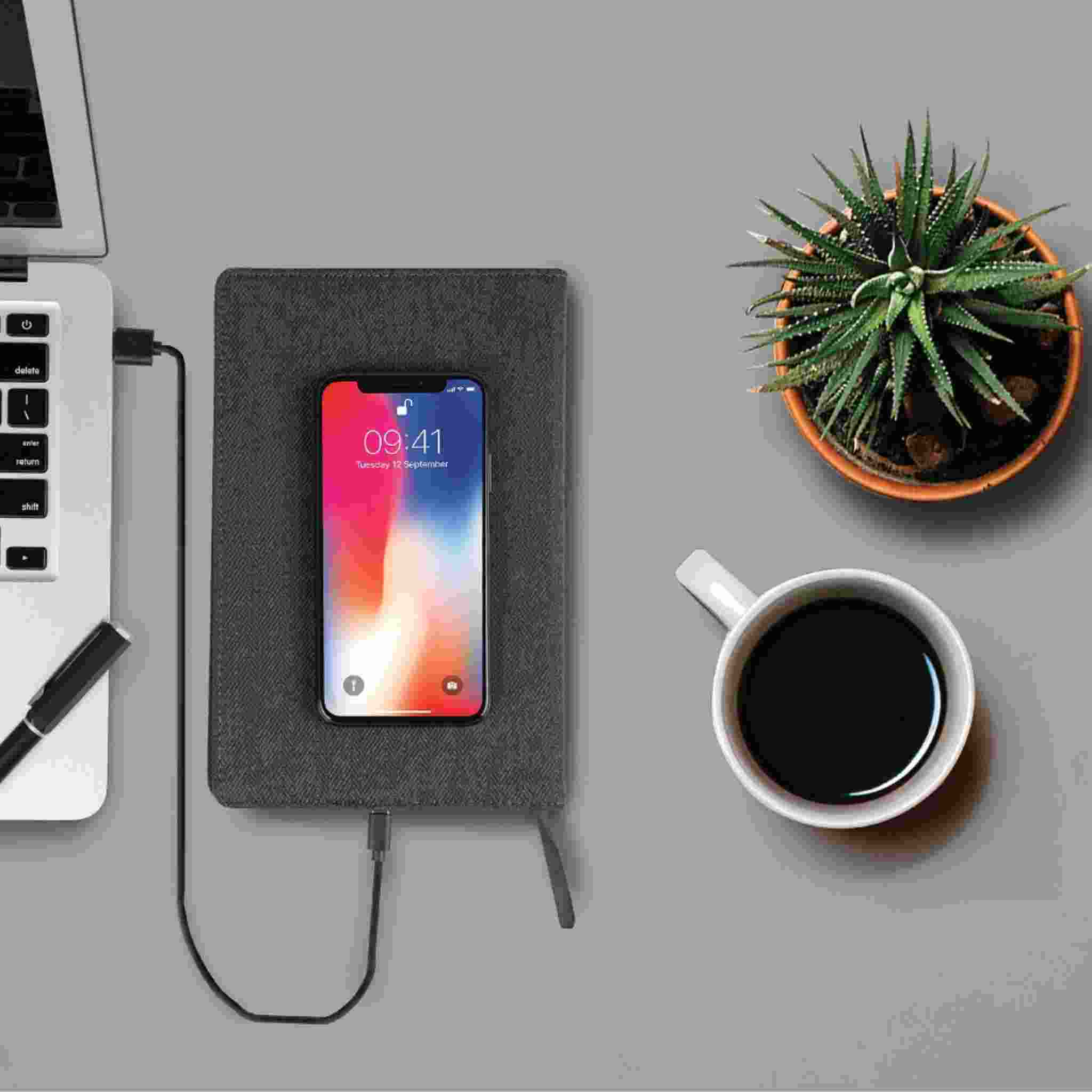 A5 Refillable Notebook With Wireless Charger on table top with office accessories