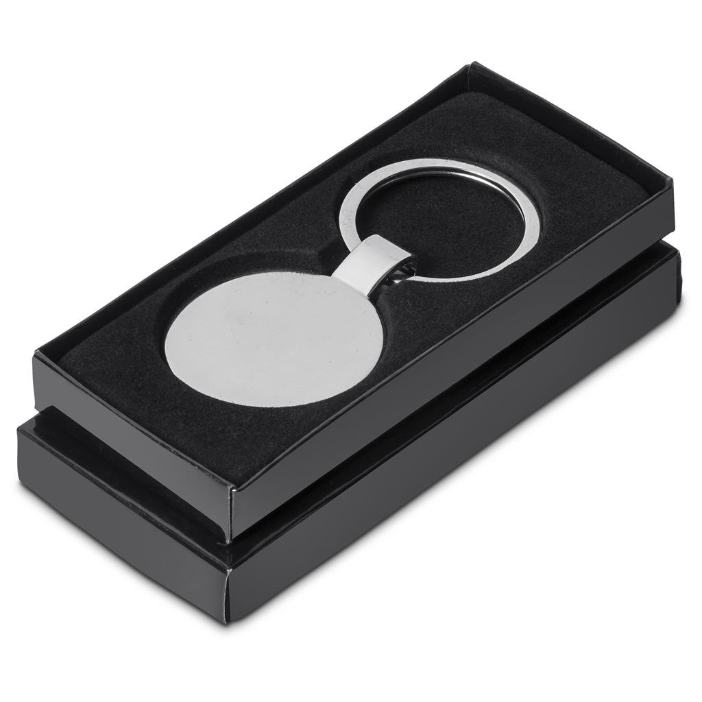 Silver keychain in a black box on a white background