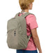 Olive coloured backpack carried by a model on her back