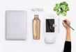Gold stainless steel bottle combined with other office accessories