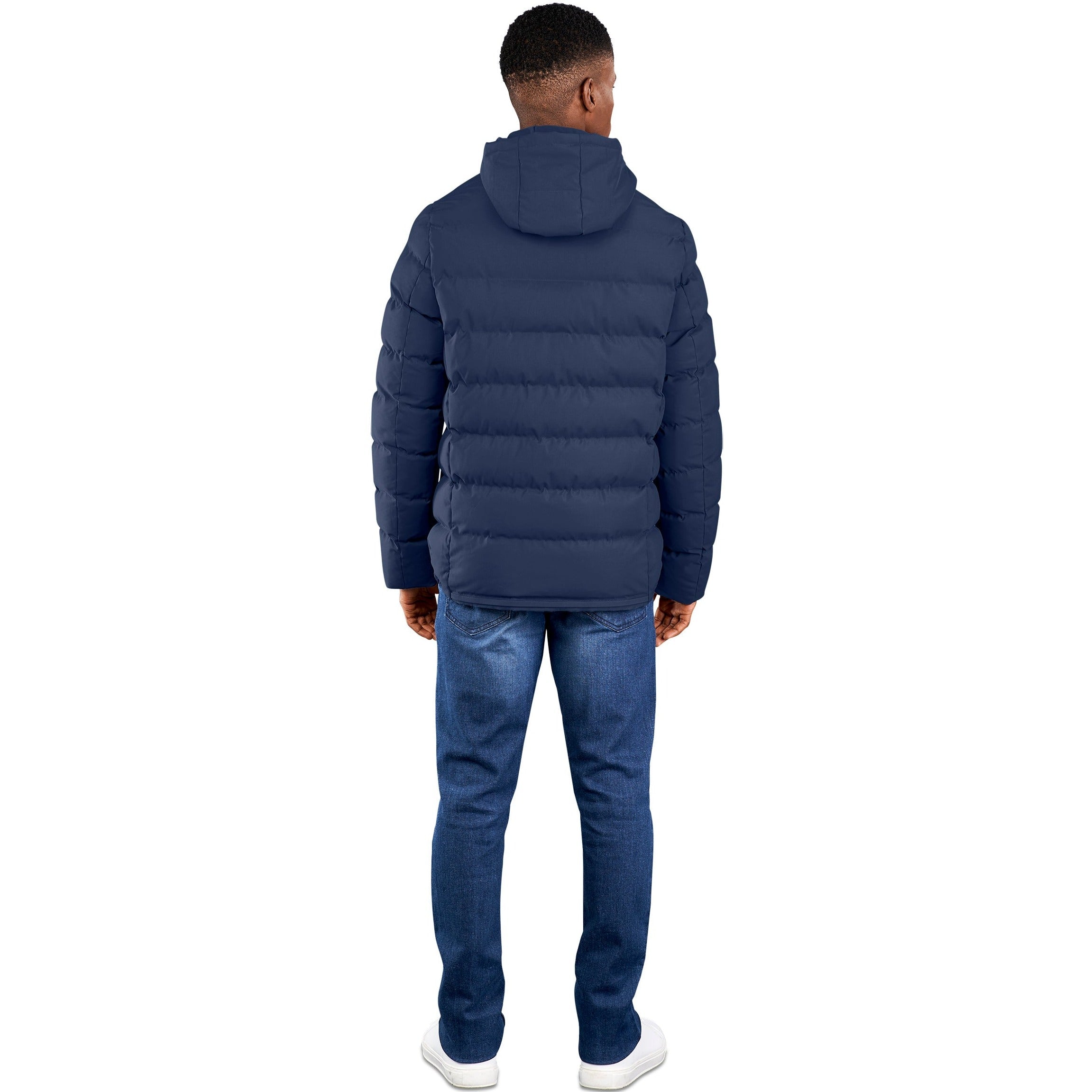 Man showing the back view of a blue padded mountain jacket