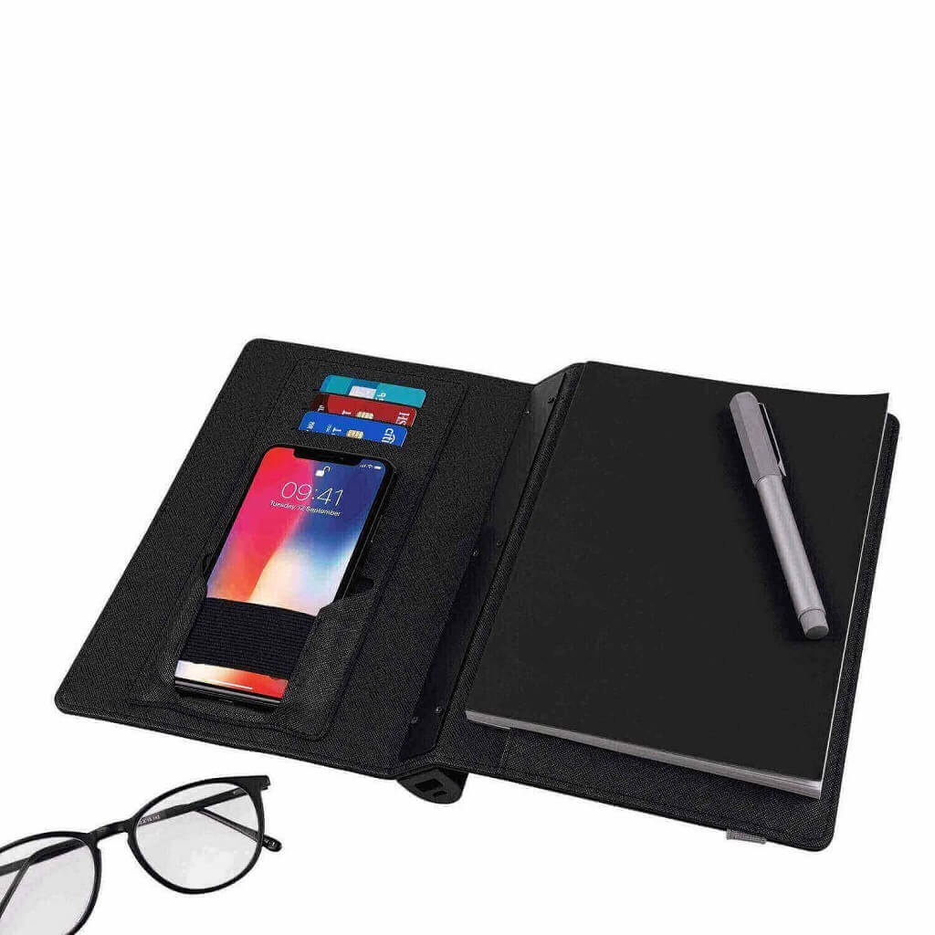 Notebook and wireless powerbank shown with a ballpoint pen & accessory